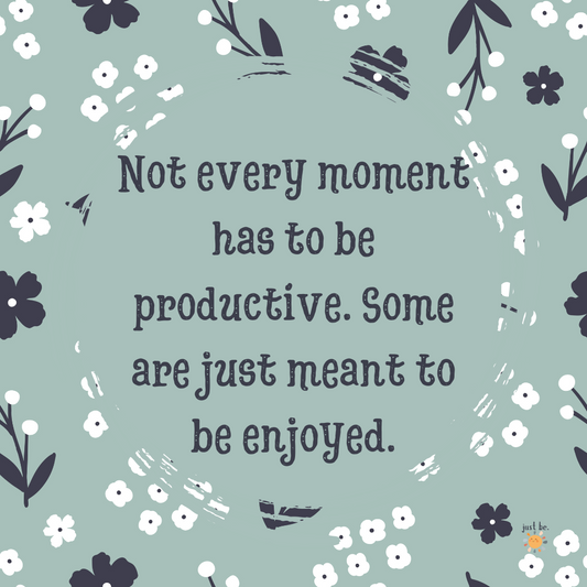 A digital graphic with a muted green background, decorated with a floral pattern. The quote reads, "Not every moment has to be productive. Some are just meant to be enjoyed." A small "just be." logo appears in the bottom right corner.