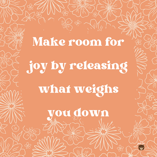 Inspirational quote on a floral background that says, "Make room for joy by releasing what weighs you down."
