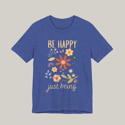 tshirt with the words be happy just being. Design has spring flowers butterflies a rainbow and a bee.
